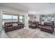 Open living area with leather furniture and a view to the kitchen at 18242 W Colter St, Litchfield Park, AZ 85340