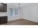 Bright dining area with hardwood floors and a modern chandelier at 1845 E Hampton Ave, Mesa, AZ 85204