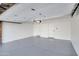 Spacious two-car garage with epoxy flooring and extra storage at 1845 E Hampton Ave, Mesa, AZ 85204