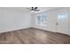 Bright and airy living room with hardwood floors and a ceiling fan at 1845 E Hampton Ave, Mesa, AZ 85204