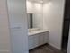 Bathroom with double vanity and large mirror at 18864 E Bruno Dr, Gold Canyon, AZ 85118