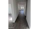 Long hallway with wood-look tile flooring at 18864 E Bruno Dr, Gold Canyon, AZ 85118