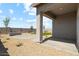 A spacious backyard with a rock landscape design and large covered patio area at 18864 E Bruno Dr, Gold Canyon, AZ 85118