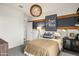 A stylishly decorated bedroom featuring a unique lighting fixture and modern furnishings at 18864 E Bruno Dr, Gold Canyon, AZ 85118