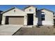 Charming single-story home featuring a two-car garage, a covered porch, and low-maintenance landscaping at 18864 E Bruno Dr, Gold Canyon, AZ 85118