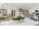 Open living space with a view from the dining area to the living room, showcasing modern décor at 18864 E Bruno Dr, Gold Canyon, AZ 85118