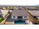 Aerial view of house with pool and pergola at 19042 W Clinton St, Surprise, AZ 85388