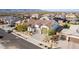 Aerial view of a beautiful home in a desirable neighborhood with solar panels at 19042 W Clinton St, Surprise, AZ 85388