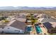 Aerial view of house with pool and mountain views at 19042 W Clinton St, Surprise, AZ 85388