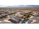 Aerial view of house with pool and mountain views at 19042 W Clinton St, Surprise, AZ 85388