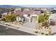 Single-story home with a three-car garage and landscaped yard at 19042 W Clinton St, Surprise, AZ 85388