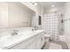 Clean bathroom with double vanity and shower/tub combo at 19042 W Clinton St, Surprise, AZ 85388