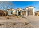 Beautiful two-story home with desert landscaping and a three-car garage at 19042 W Clinton St, Surprise, AZ 85388