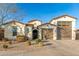 Stunning curb appeal with a charming two-story home and landscaped yard at 19042 W Clinton St, Surprise, AZ 85388