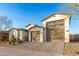 Exterior view of a charming two-story house with a large three-car garage at 19042 W Clinton St, Surprise, AZ 85388