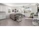 Spacious living room featuring a gray sectional sofa and wood-look floors at 19042 W Clinton St, Surprise, AZ 85388