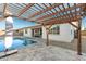 Relaxing poolside pergola with string lights and patio at 19042 W Clinton St, Surprise, AZ 85388