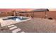 Relaxing pool area with a water feature and spacious patio at 19042 W Clinton St, Surprise, AZ 85388