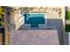 Overhead view of a pristine turquoise pool with a wooden pergola at 19042 W Clinton St, Surprise, AZ 85388