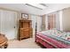 Guest bedroom with antique furniture and window seat at 19410 N 77Th Dr, Glendale, AZ 85308