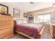 Bedroom with wood dresser and window seat at 19410 N 77Th Dr, Glendale, AZ 85308