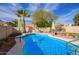 Inviting swimming pool with a waterfall feature in backyard at 19410 N 77Th Dr, Glendale, AZ 85308