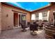 Covered patio area with comfortable seating and tile flooring perfect for outdoor gatherings at 20620 W Walton Dr, Buckeye, AZ 85396