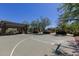 Outdoor community basketball court with covered picnic area and playground in the background at 20620 W Walton Dr, Buckeye, AZ 85396