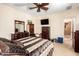 Comfortable bedroom featuring a large bed and dark wood furniture set at 20620 W Walton Dr, Buckeye, AZ 85396