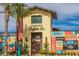 Charming Verrado Coffee Co. building with palm trees, signage, and a community board at 20620 W Walton Dr, Buckeye, AZ 85396