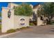 Elegant entrance to The Center on Main, featuring a decorative wall, tasteful landscaping at 20620 W Walton Dr, Buckeye, AZ 85396