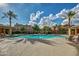 Bright community pool area showcasing blue skies and well-maintained lounge seating at 20620 W Walton Dr, Buckeye, AZ 85396