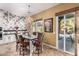 Elegant dining room featuring chandelier and easy access to the outdoor pool area at 20620 W Walton Dr, Buckeye, AZ 85396