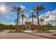 Community entrance with a decorative gate and desert landscaping at 20620 W Walton Dr, Buckeye, AZ 85396