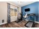 Exercise room with hardwood floors and fitness equipment at 20620 W Walton Dr, Buckeye, AZ 85396