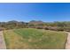 Golf course tee box showcasing the desert landscape and mountain views on a sunny day at 20620 W Walton Dr, Buckeye, AZ 85396