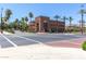 Street view of a charming red brick building with palm trees in a well-maintained neighborhood at 20620 W Walton Dr, Buckeye, AZ 85396