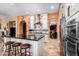 Modern kitchen with stainless steel appliances and a large island with barstool seating at 20620 W Walton Dr, Buckeye, AZ 85396