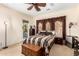 Comfortable main bedroom with a ceiling fan, chest, and outside access at 20620 W Walton Dr, Buckeye, AZ 85396