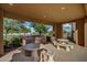 Outdoor kitchen area with a built-in grill and covered dining area, perfect for entertaining at 20620 W Walton Dr, Buckeye, AZ 85396