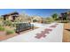 Community park area with seating, hopscotch, and landscaping at 20620 W Walton Dr, Buckeye, AZ 85396