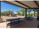 Covered picnic area with tables and benches next to a community playground at 20620 W Walton Dr, Buckeye, AZ 85396