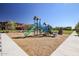 Neighborhood playground with slides, climbing structures and green space in a Gathering community at 20620 W Walton Dr, Buckeye, AZ 85396