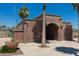 Exterior view of the Redmond Field restrooms, a brick building with archways and landscaping at 20620 W Walton Dr, Buckeye, AZ 85396