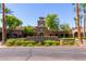 Verrado Golf Club entrance showcasing lush landscaping and inviting architectural details at 20620 W Walton Dr, Buckeye, AZ 85396