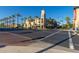 View of the shops with tower, street parking, trees, and pedestrian access on a sunny day at 20620 W Walton Dr, Buckeye, AZ 85396