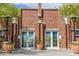 Exterior of the Heritage Swim Park with brick facade, planter boxes, and double door entry at 20620 W Walton Dr, Buckeye, AZ 85396