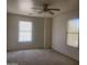 Spacious bedroom with natural light from two bright windows at 2113 E Sunland Ave, Phoenix, AZ 85040