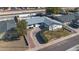 Aerial view of a home with a gray roof and a green lawn, complemented by a private pool in the backyard at 2113 N 66Th St, Scottsdale, AZ 85257