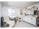 Bright bathroom with dual sinks, a soaking tub, and large window overlooking the pool at 2113 N 66Th St, Scottsdale, AZ 85257